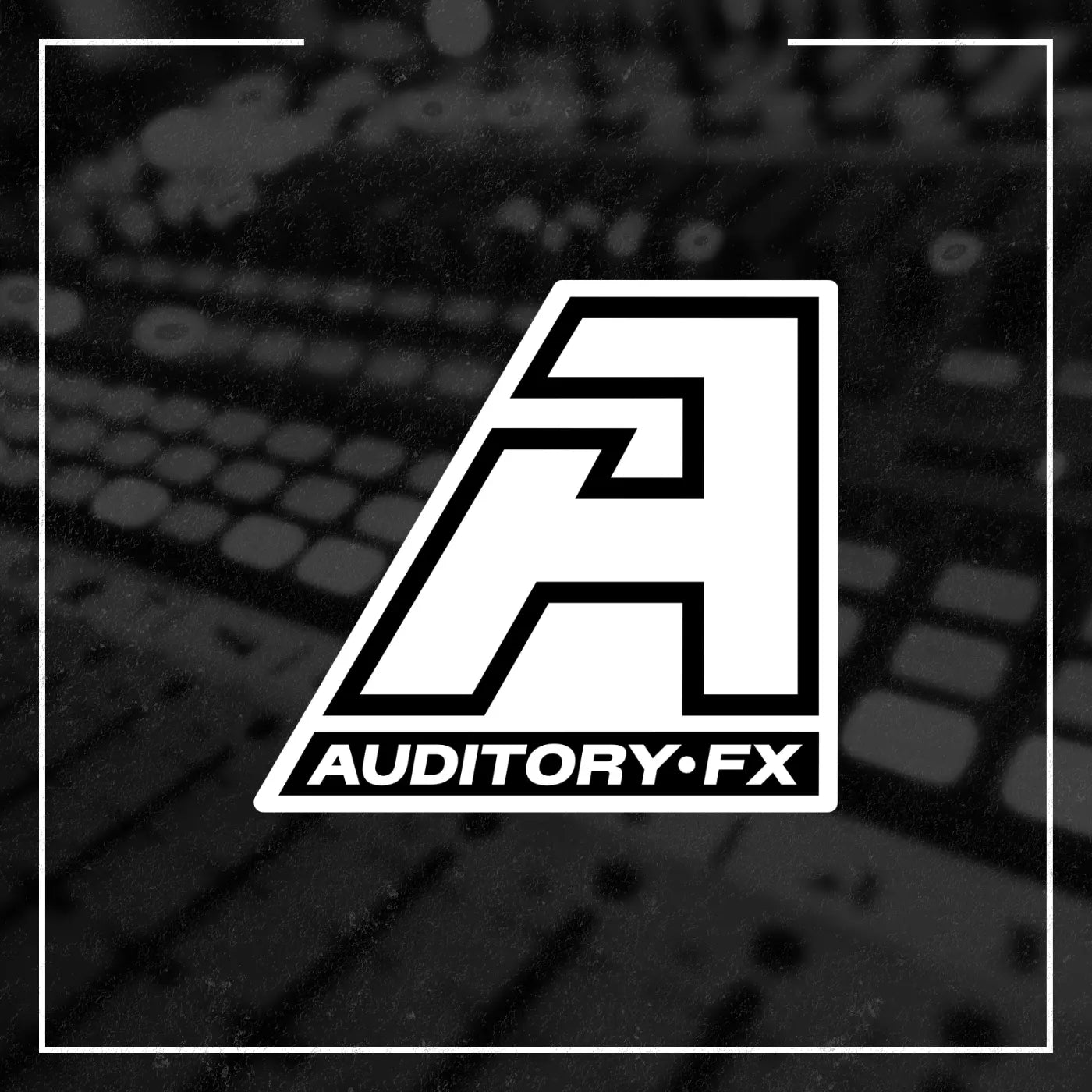 A stylized white geometric logo with the text 'AUDITORY.FX' centered over a dark, blurred audio mixing board background, framed by a thin white border.